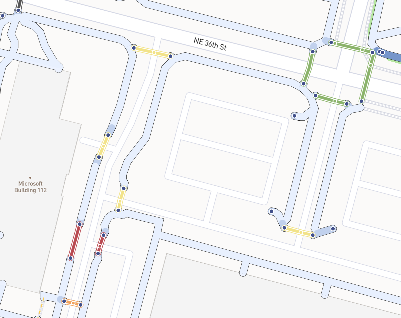 A screenshot of crossings in AccessMap; the different colorings reflect the different forms of traffic control present at each crossing.